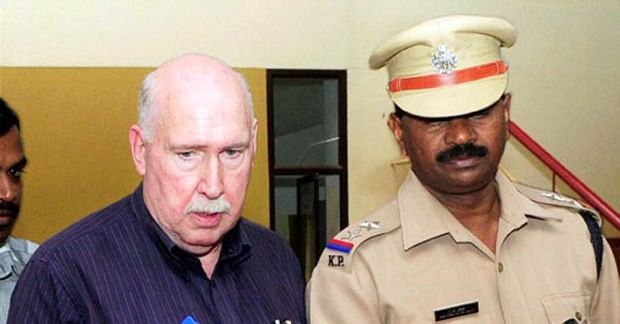 Amway India CEO William Scott Pinckney with a policeman (Photo: PTI) Amway India CEO William Scott Pinckney with a policeman (Photo: PTI)